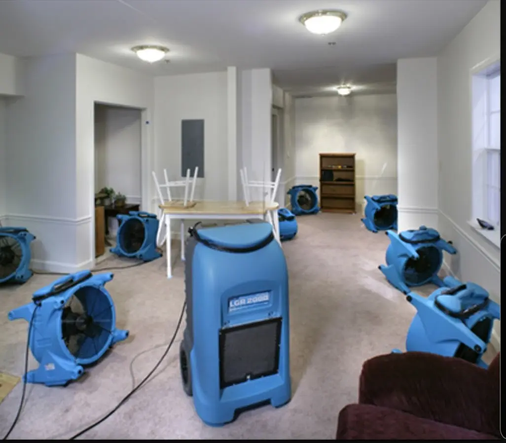 Air movers and dehumidifier setup for Water Damage Restoration in Milliken